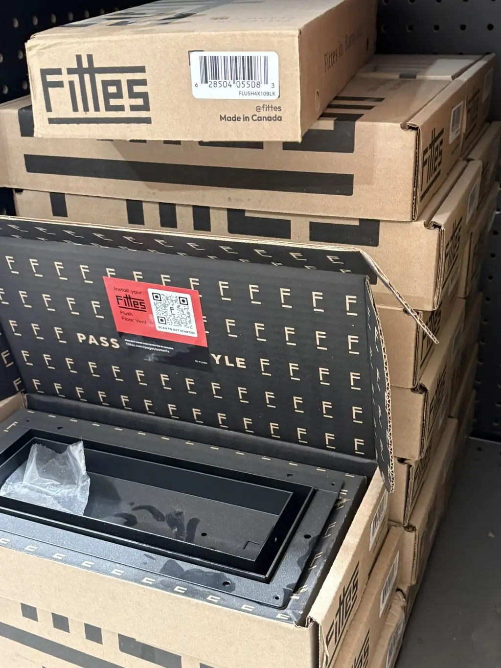 Open box of a Fittes 4x10 flush floor vent in matte black at Sundry Pro Shop